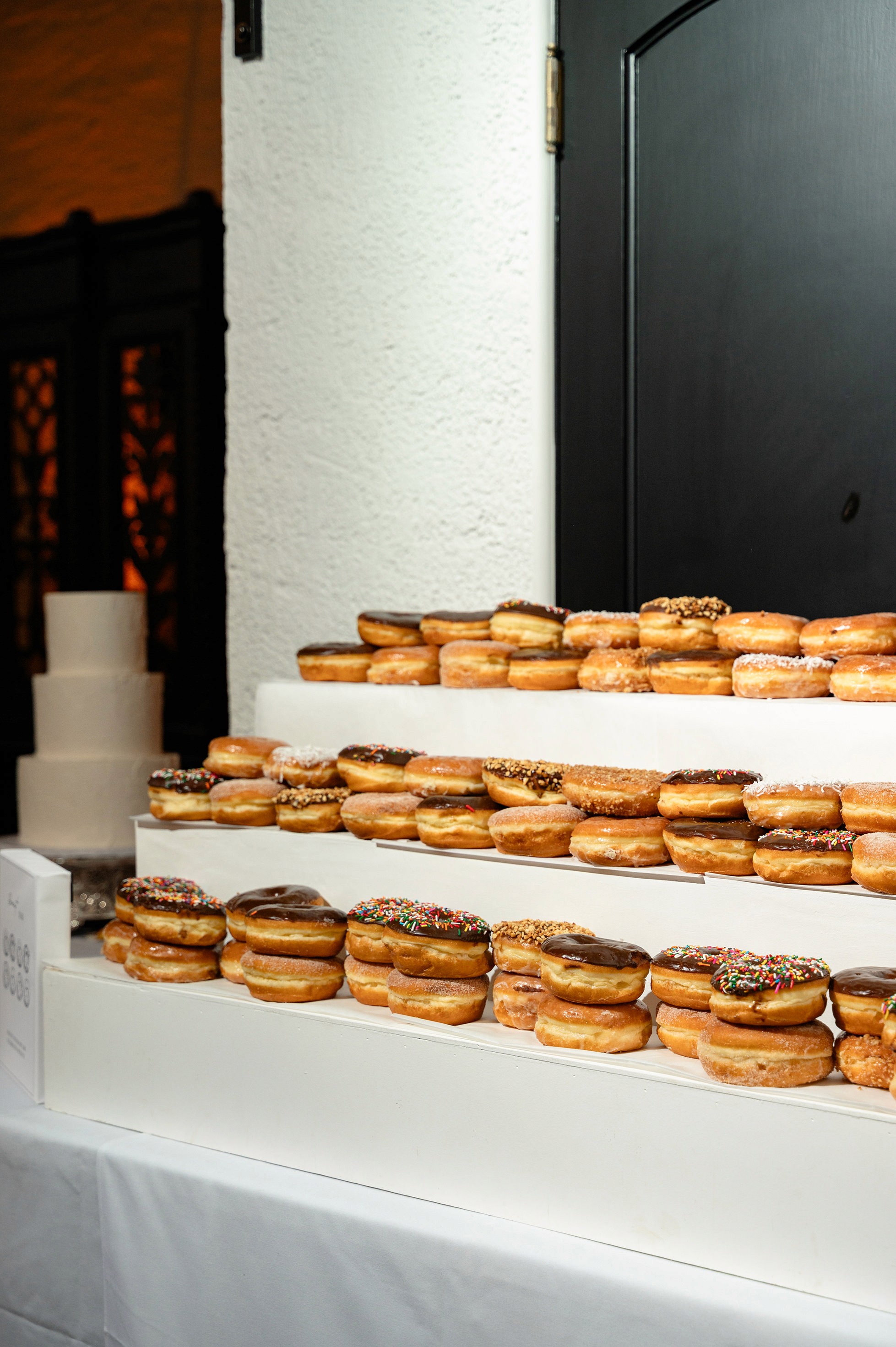 Flat lay wedding details with bouquet, rings, and sparkling bridal heels