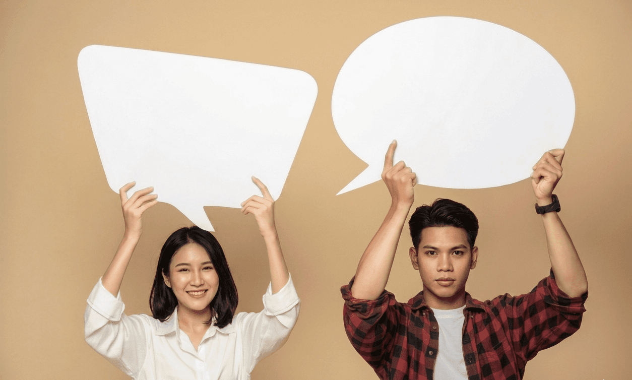 Two people holding speech bubbles about how to start a conversation naturally