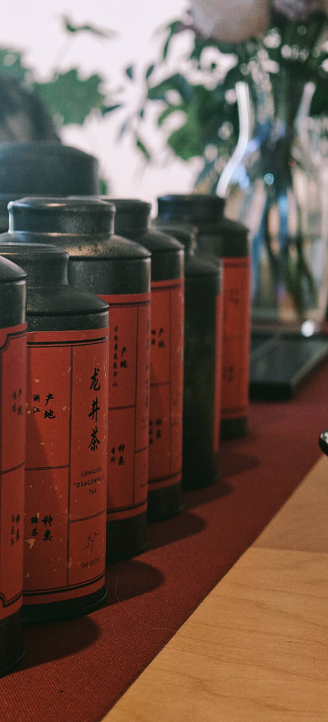 Red tea tins beside the tea service