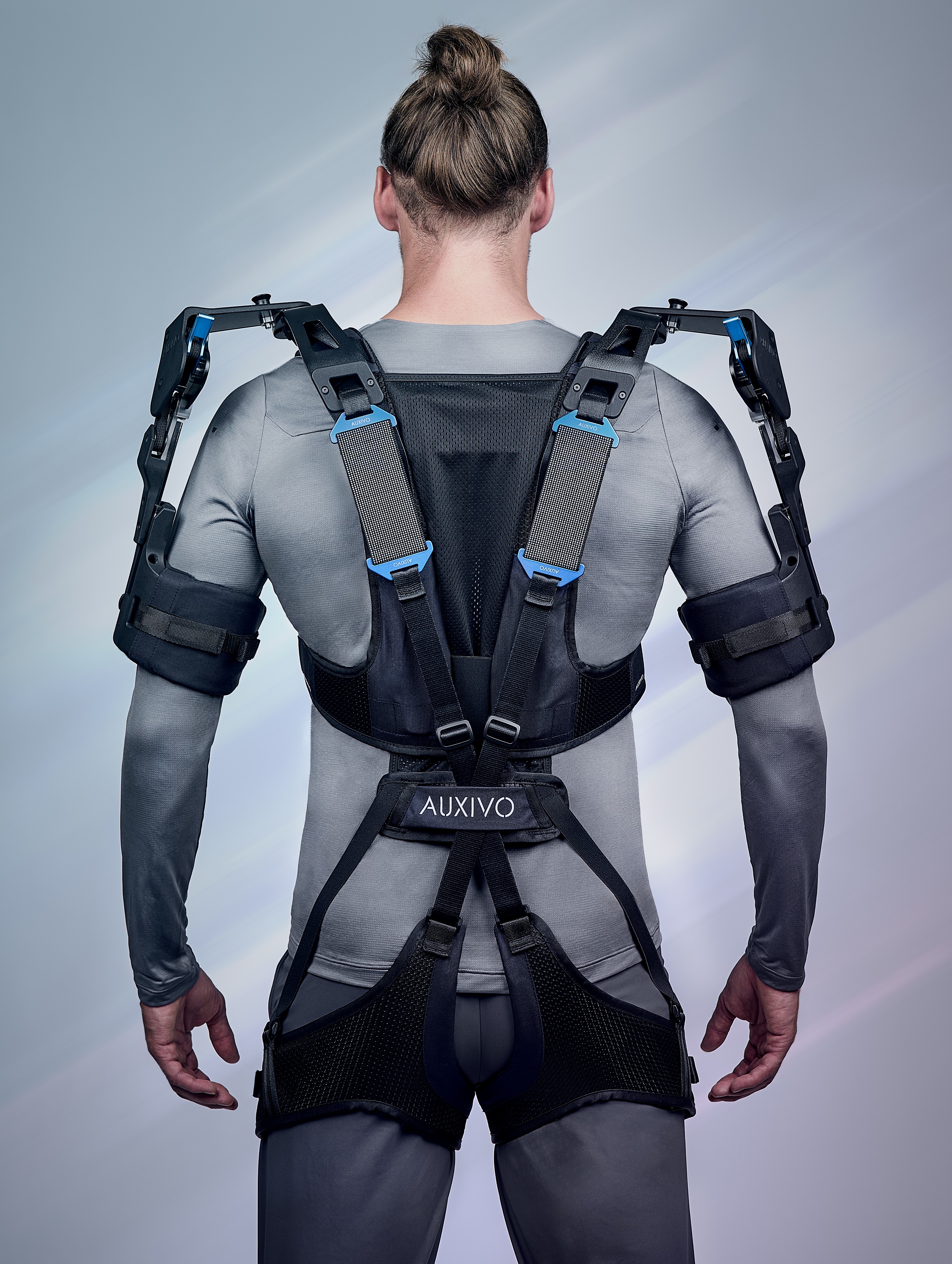 Full rear view of the OmniSuit showing the back straps and ergonomic harness to support upper body movements.