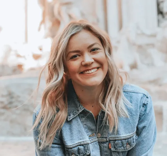 woman smiling wearing denim jacket