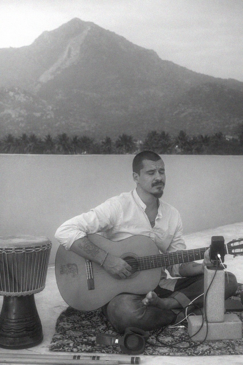 Music producer sitting in his studio