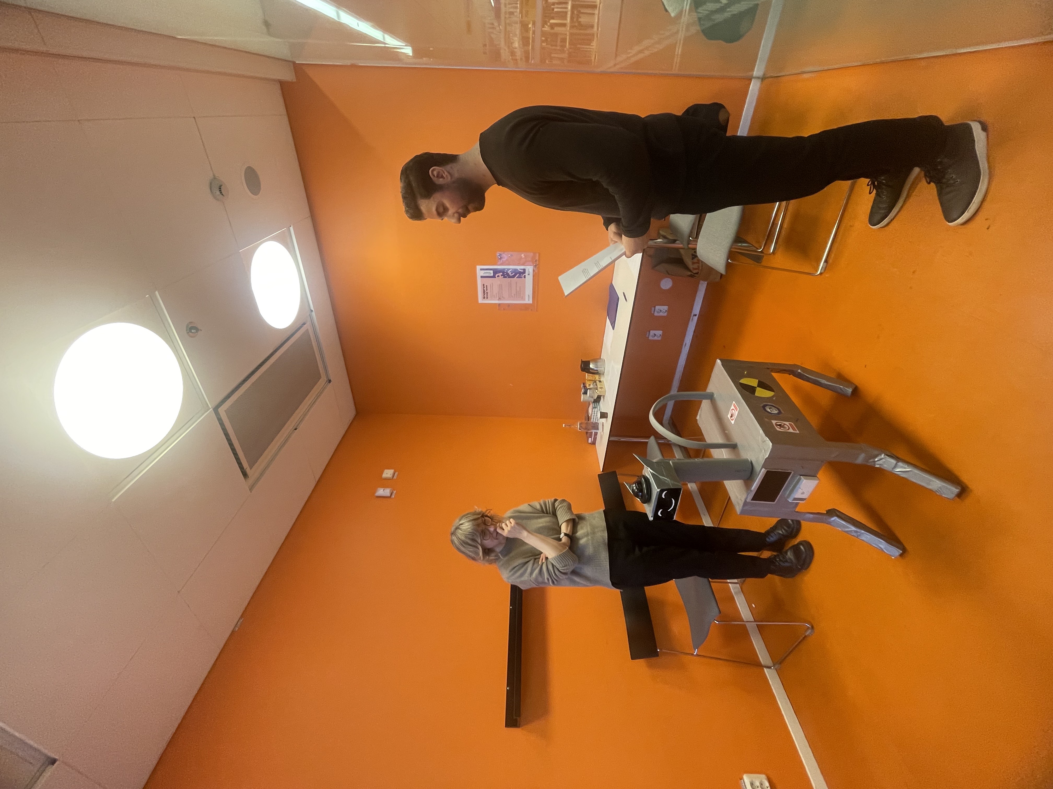 a cell phone leaning on a ledge