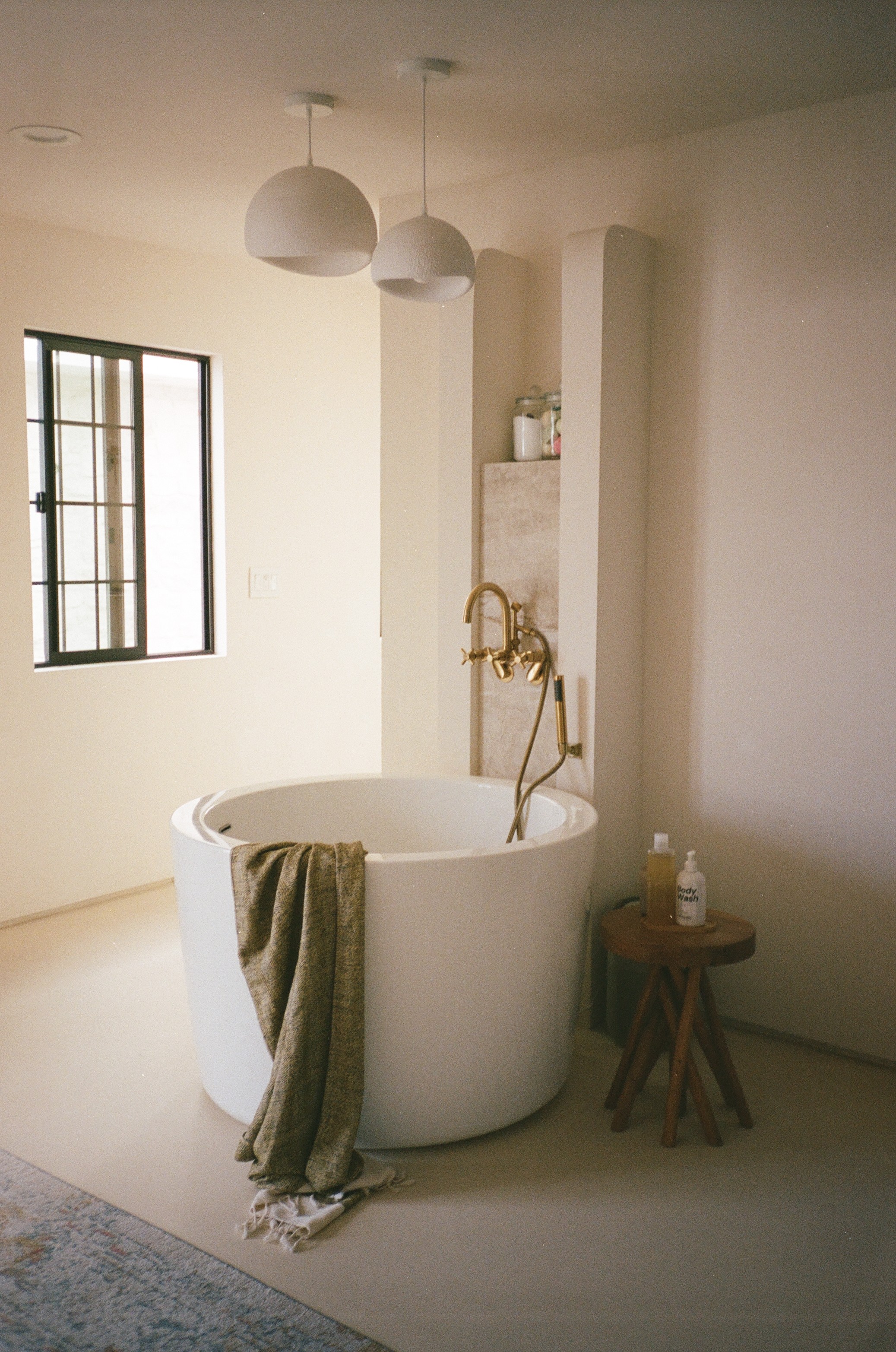 Woman walking on a curved pavement with shadow.