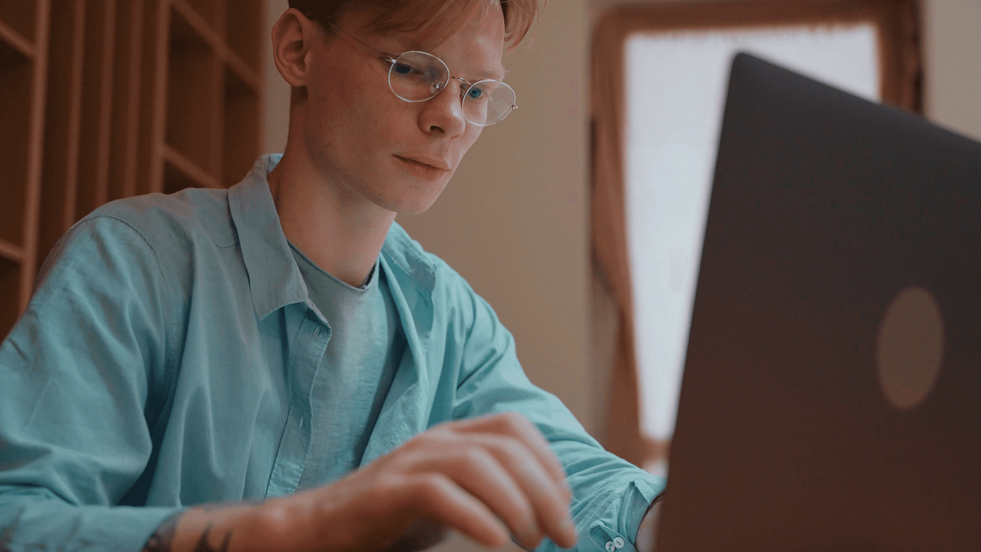 A man working on his laptop.