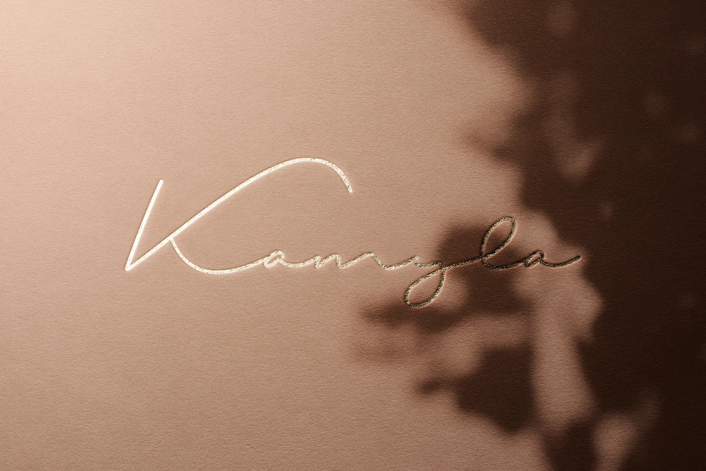 Luxury signature-style logo mockup gold foil embossed on paper surface with shadow tree.