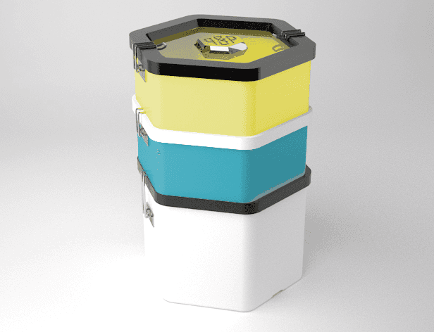 A stack of four hexagonal containers in yellow, teal, white, and black sits against a light gray background. Each container has a black lid and a silver clasp. The top yellow container has a gold-colored lid with a small white object inside. The containers are stacked vertically, with the white container at the bottom.