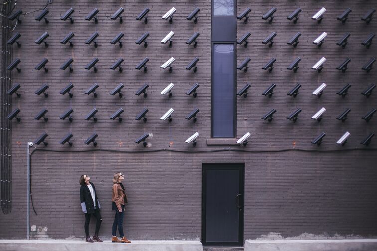 Cameras watching two people