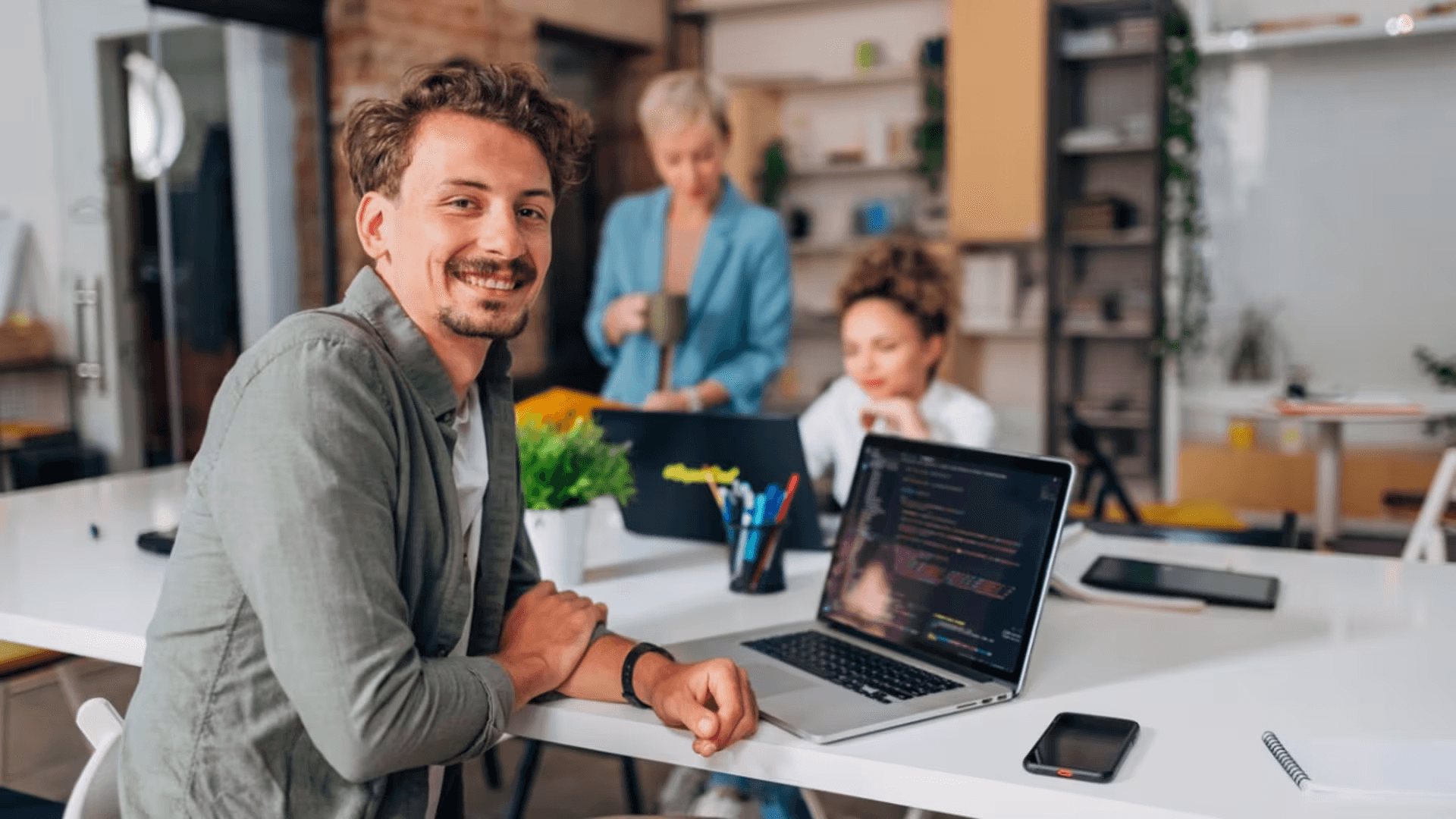 person smiling - Software Developer Contract Rates 