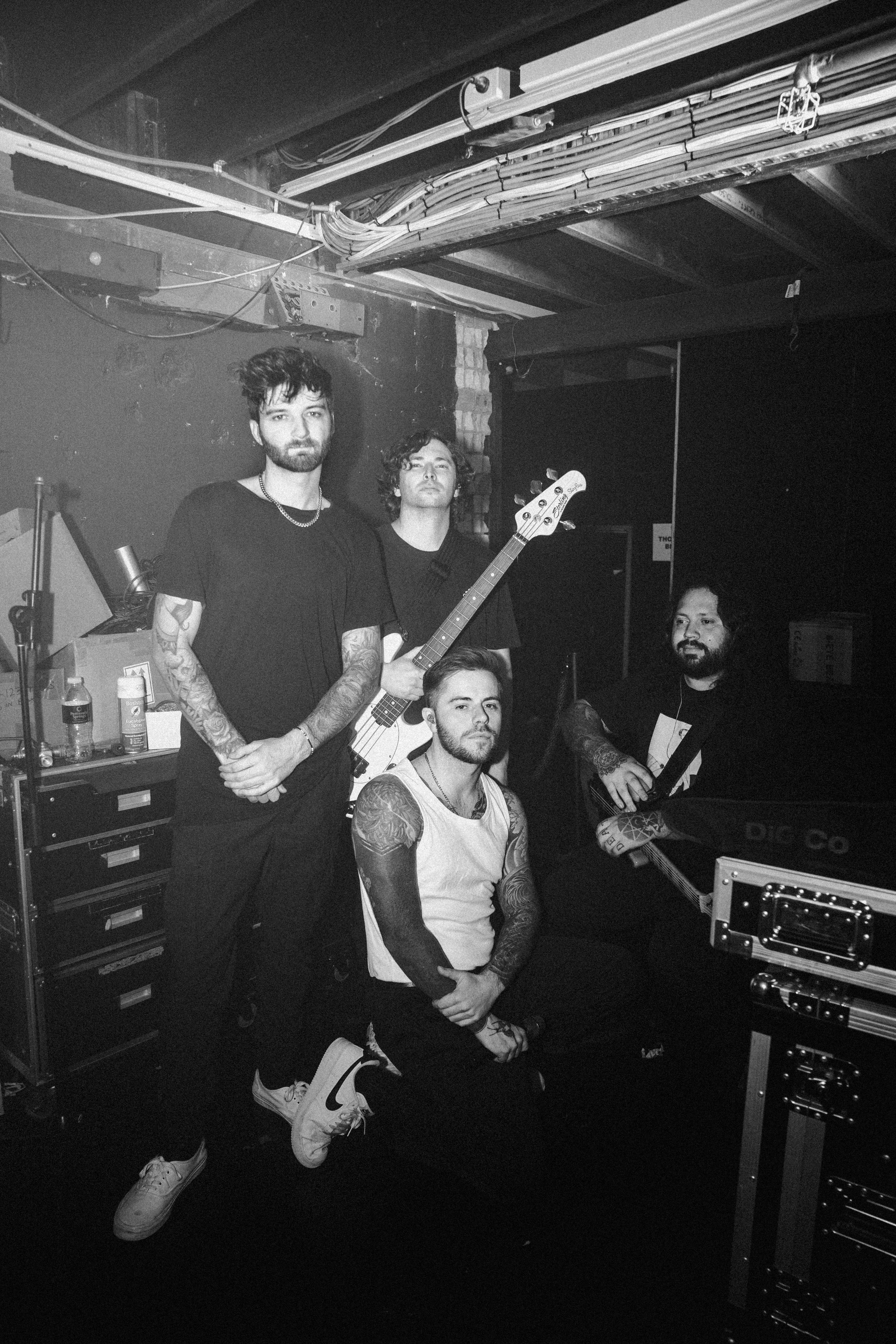 Guitarist performing on stage in silhouette