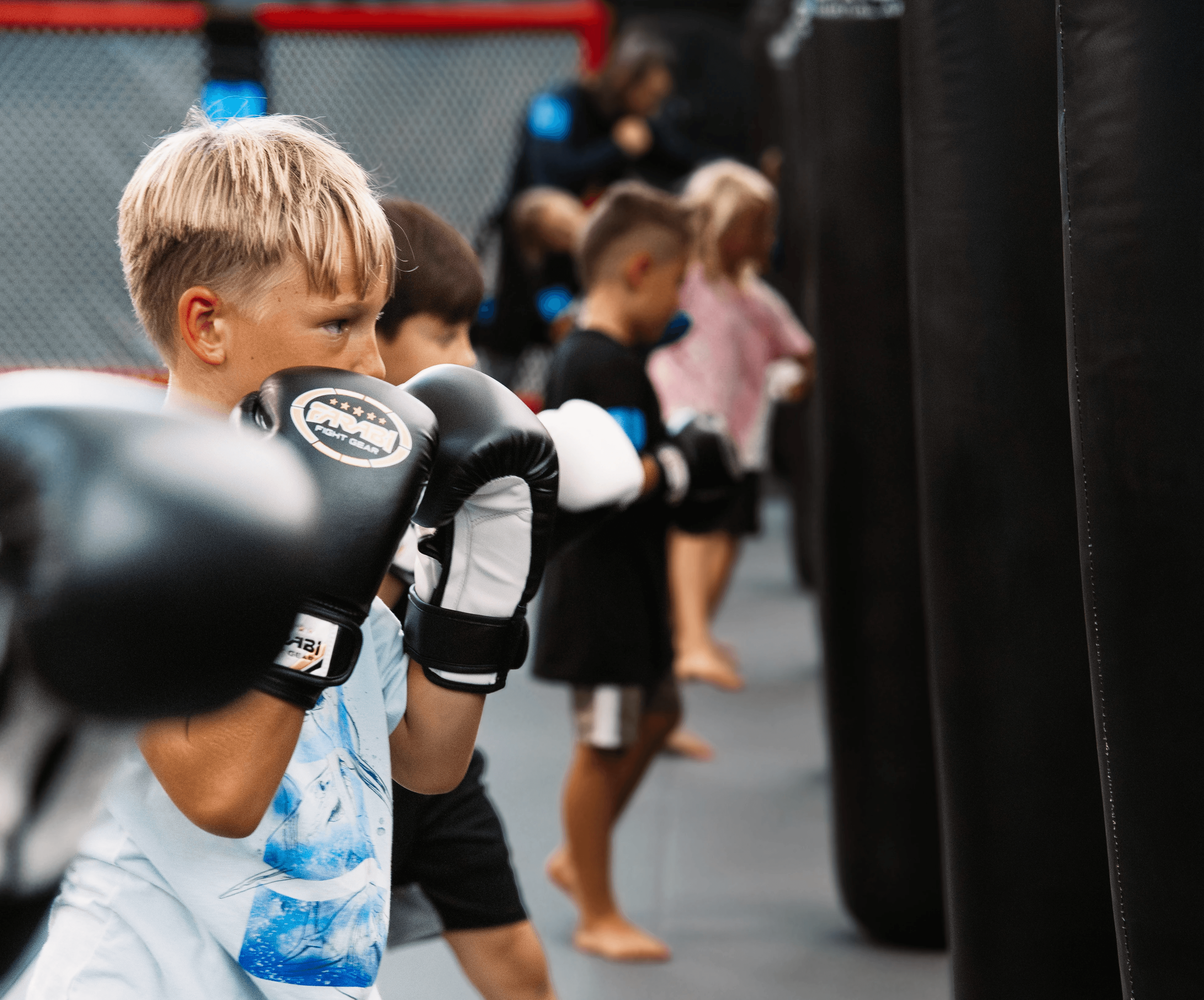 Kids hitting bags during training at Union Martial Arts