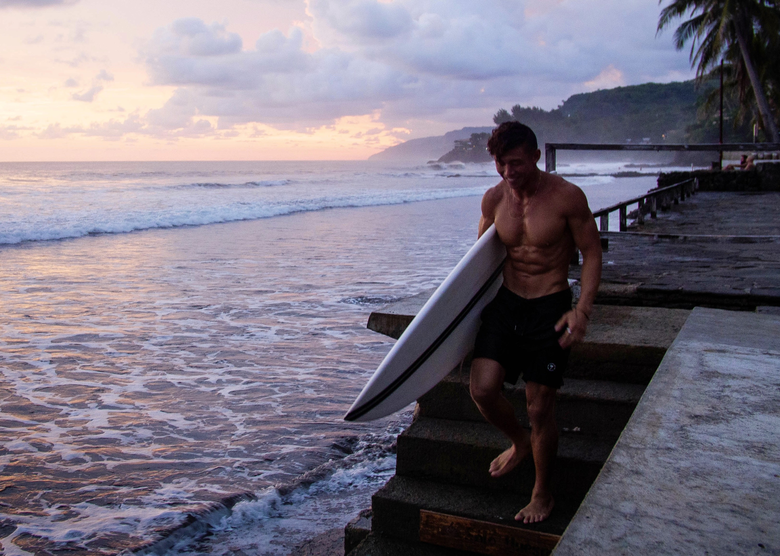 Rachel, personal trainer, looking to the side confidently in a fitness studio