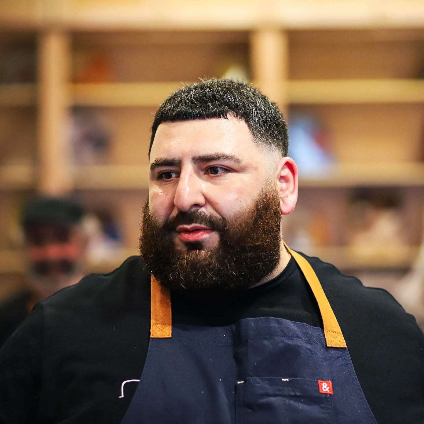 Professional private chef from FlavaVille catering and food truck services in a modern kitchen.