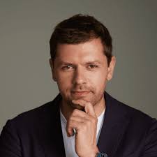 person wearing blue top smiling