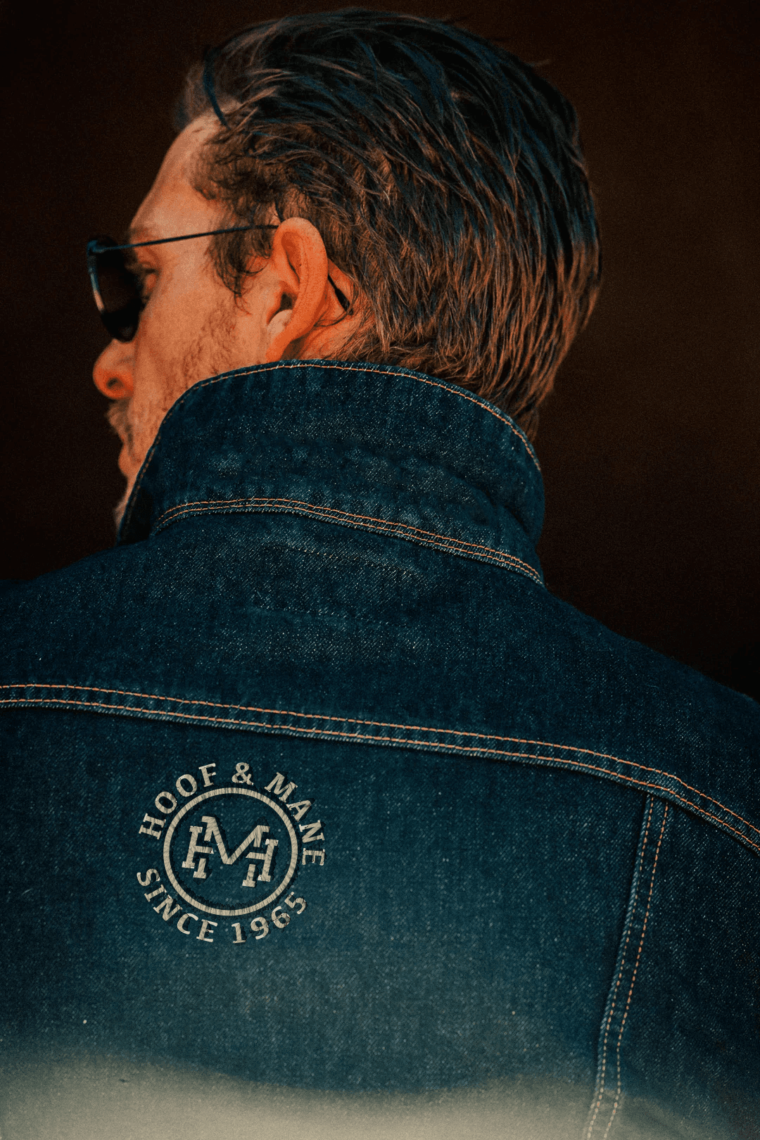Modern home office setup with a monitor, ergonomic chair, keyboard, and indoor plants near a window with blinds.