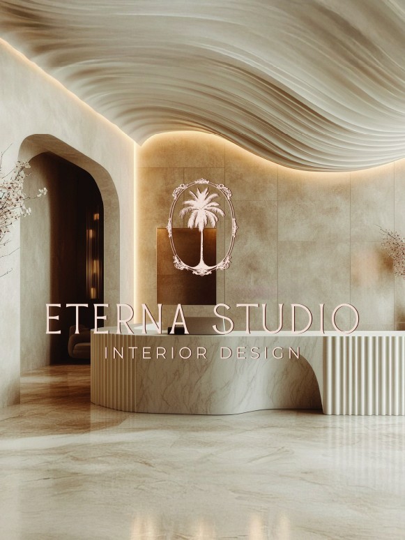 A sleek and modern interior reception area features a curved reception desk made of white marble with deep vertical grooves. The walls are adorned with soft, neutral tones and ambient lighting accentuates the textured ceiling that mimics flowing waves. A logo with a palm tree surrounded by an ornate frame is prominently displayed, marking the space for Eterna Studio Interior Design. The overall atmosphere is elegant and inviting, combining contemporary design elements with a touch of sophistication.