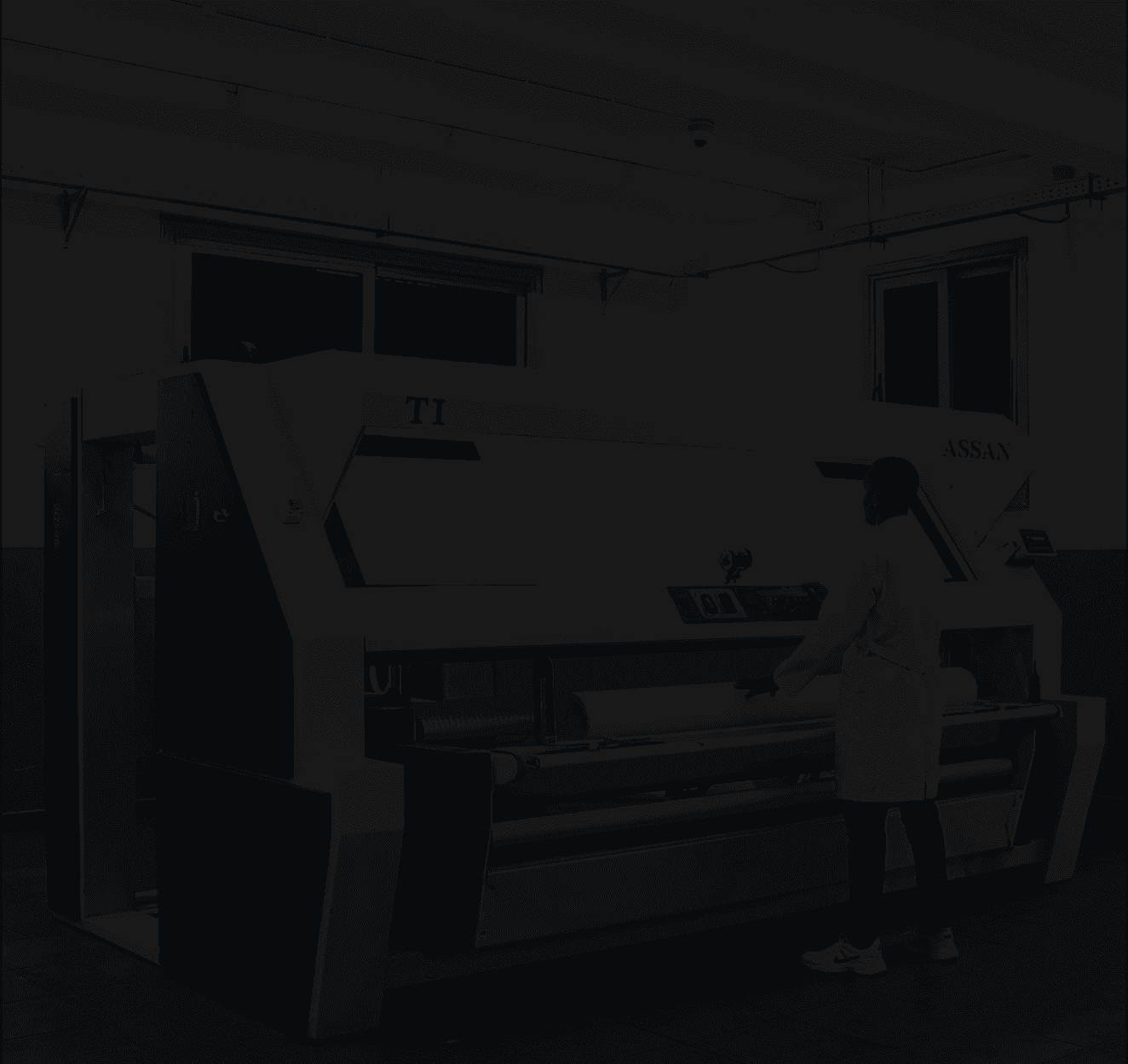 Industrial fabric processing machine.