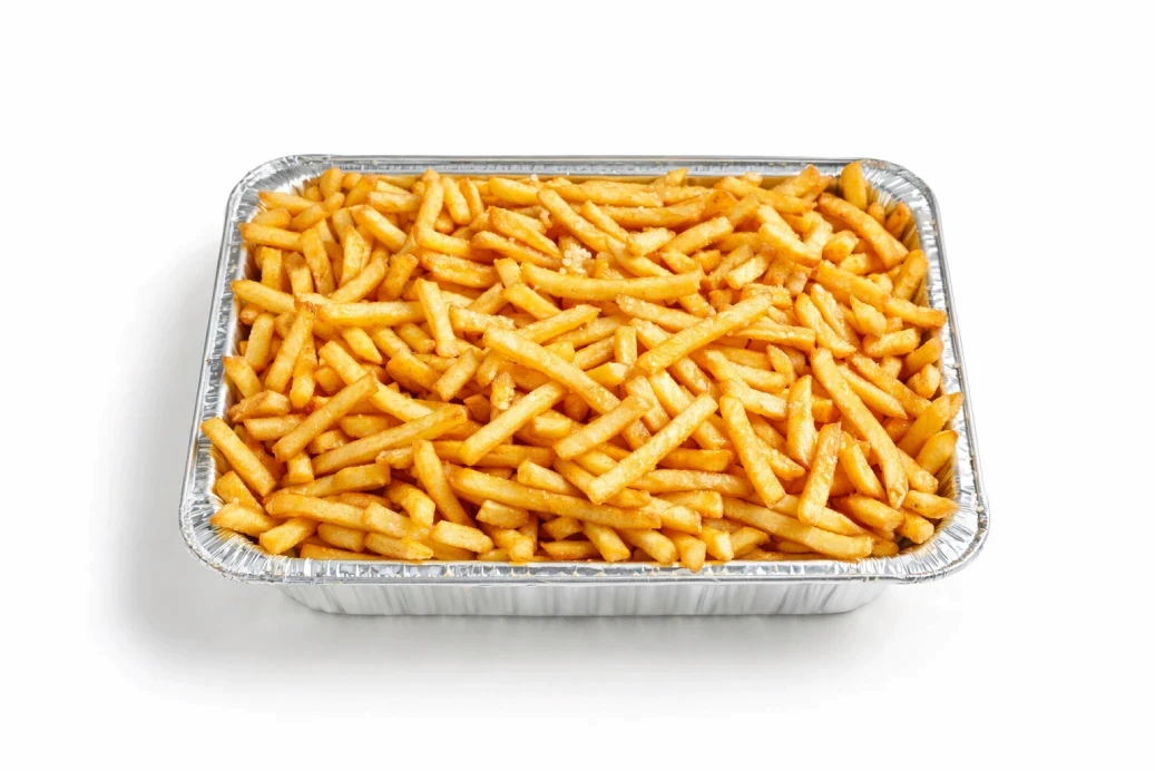 a glass bowl filled with rice on top of a white table