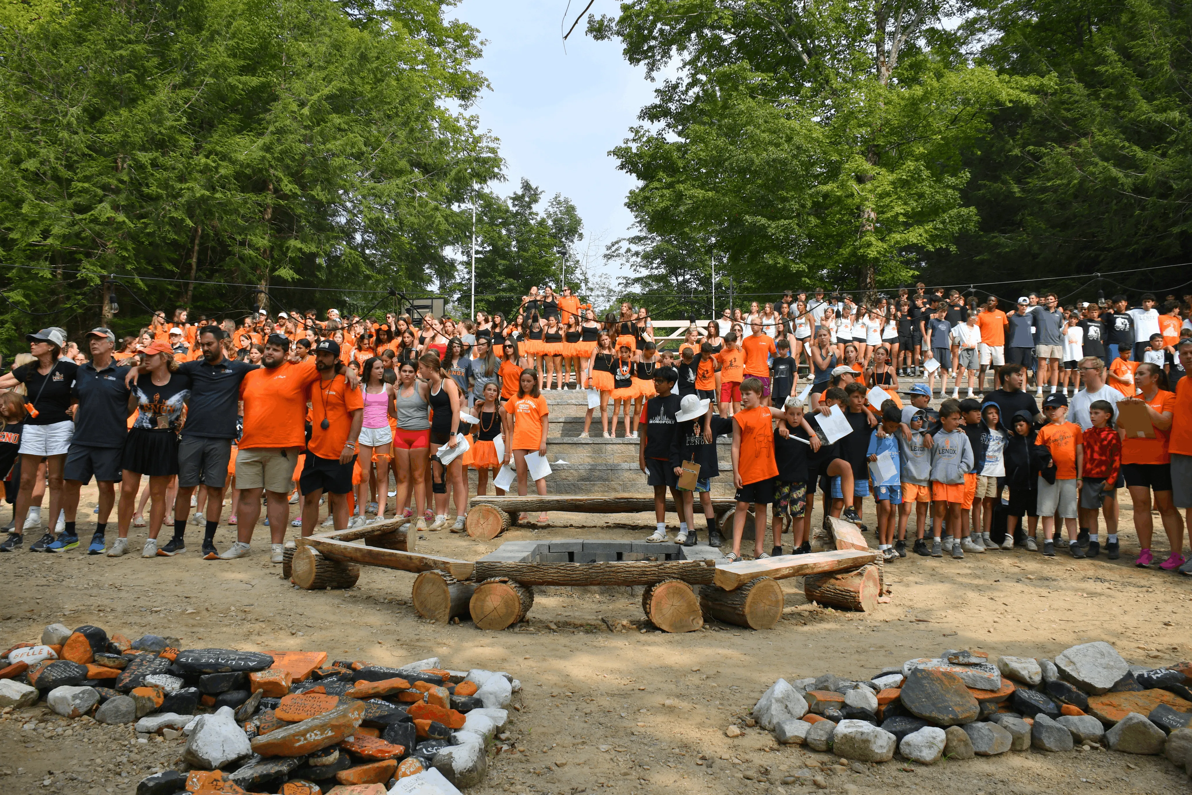 Campers and staff gathered together at a camp-wide evening event