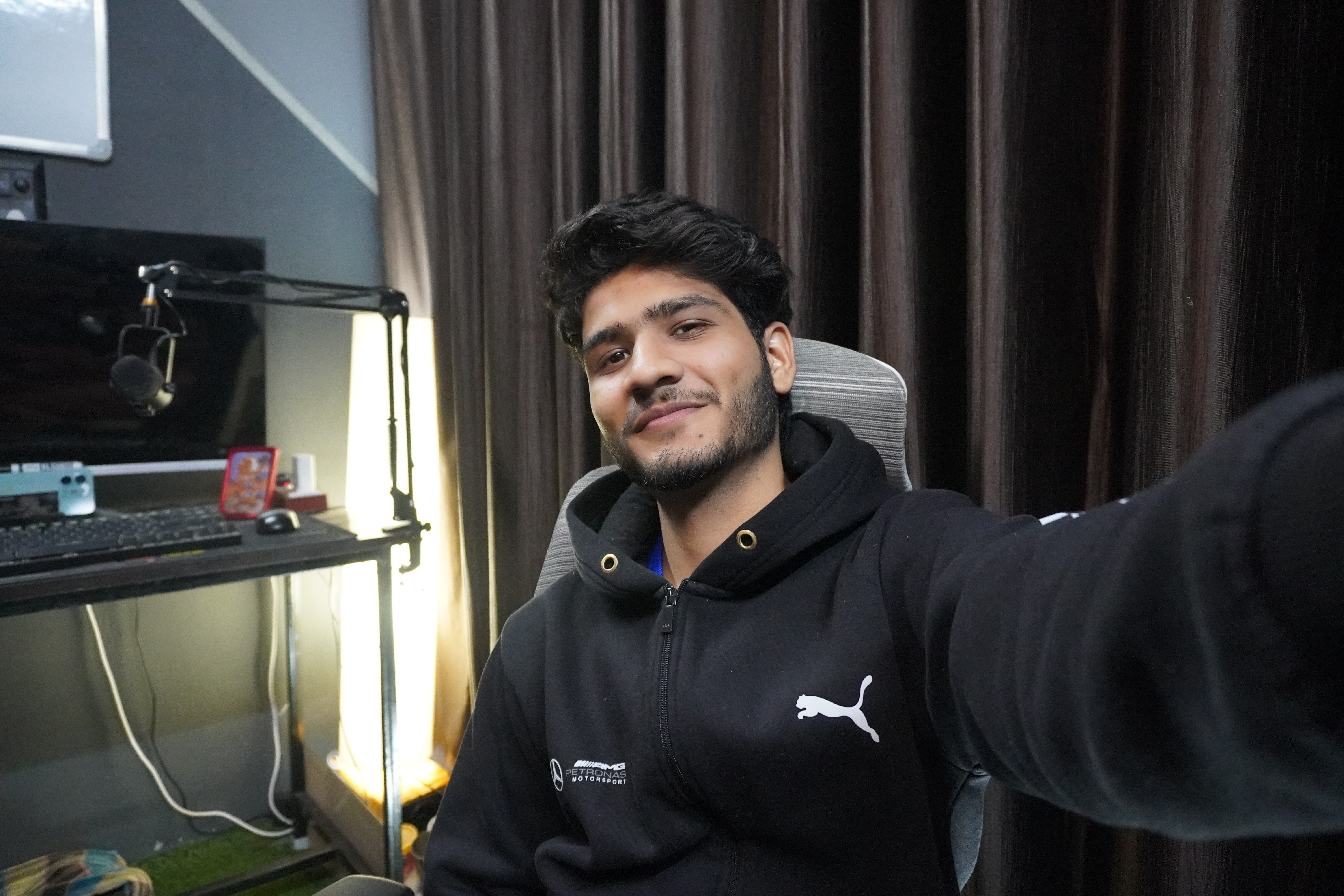 Young children in blue coats and yellow hats