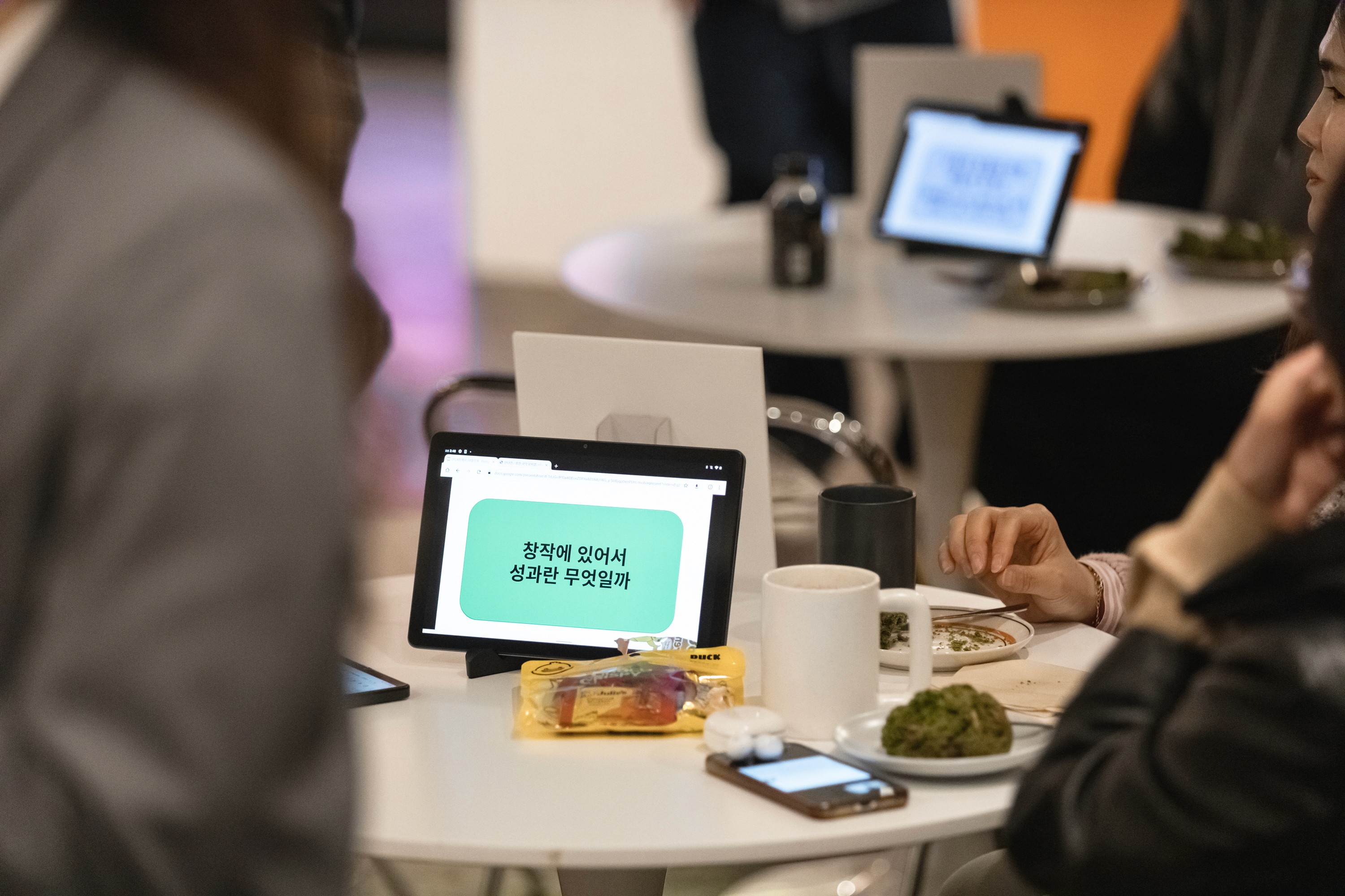 Aerial view of a winding road cutting through rocky terrain with patches of grass.