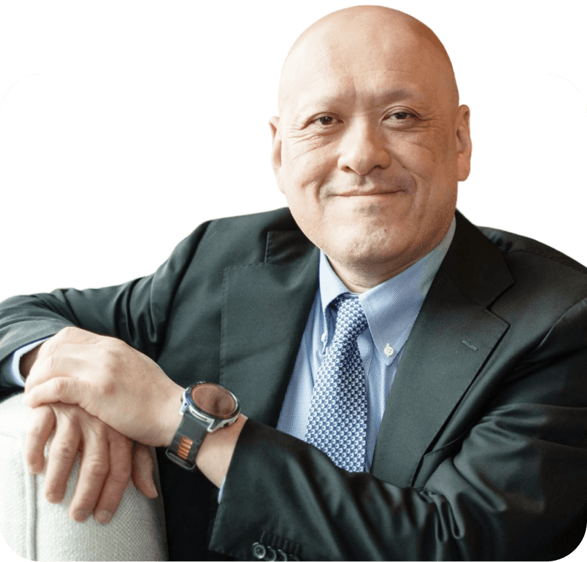 Headshot of Silver Kung in a suit with a white background