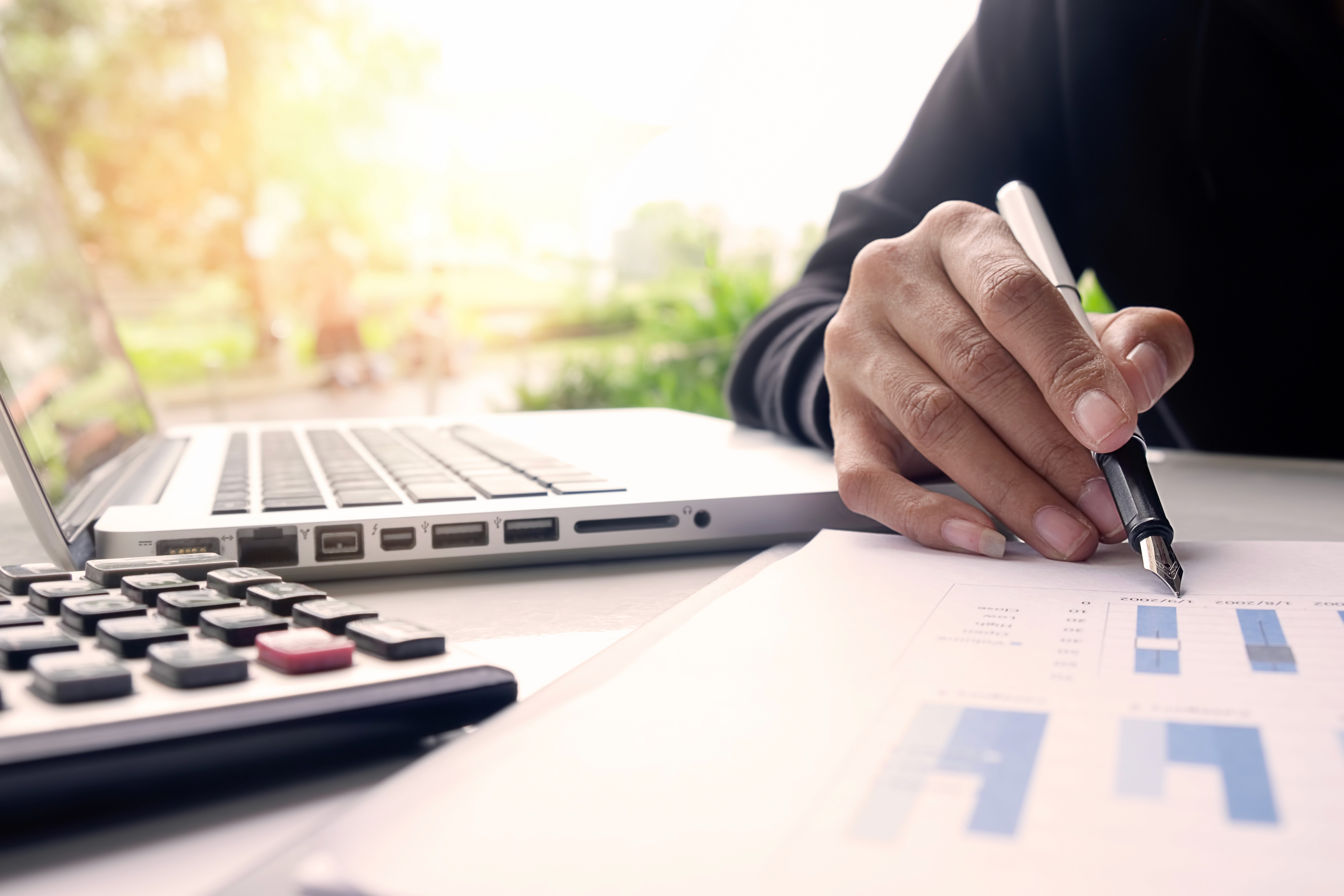 IRS Form 3115 Application for Change in Accounting Method document on a desk with a calculator and pen, representing tax strategy for startup founders.