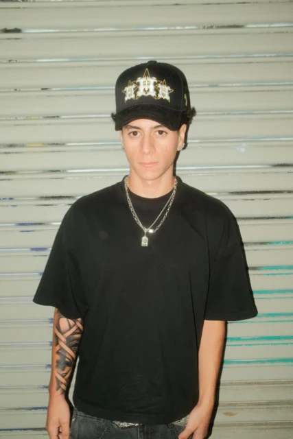 A man sitting in front of a computer on a desk