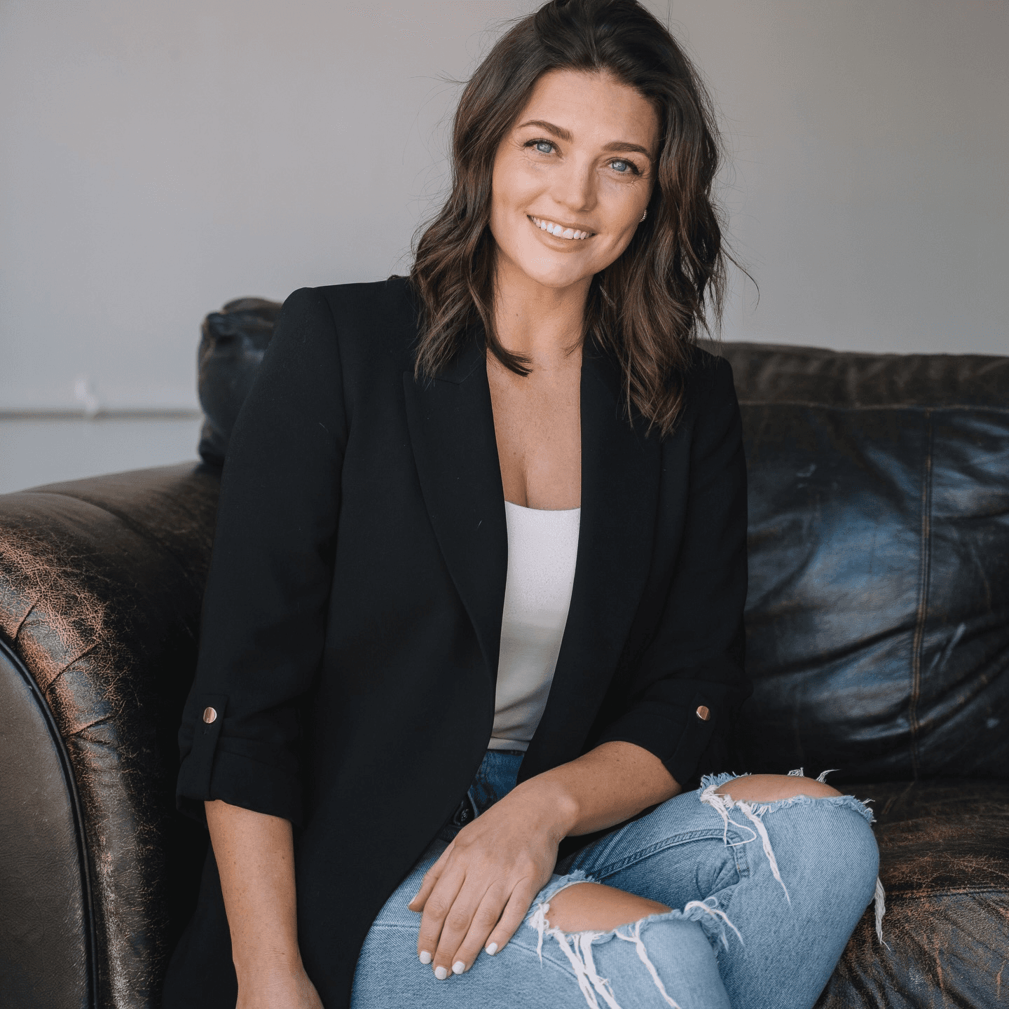 Elf woman in white dress raising hands by the river