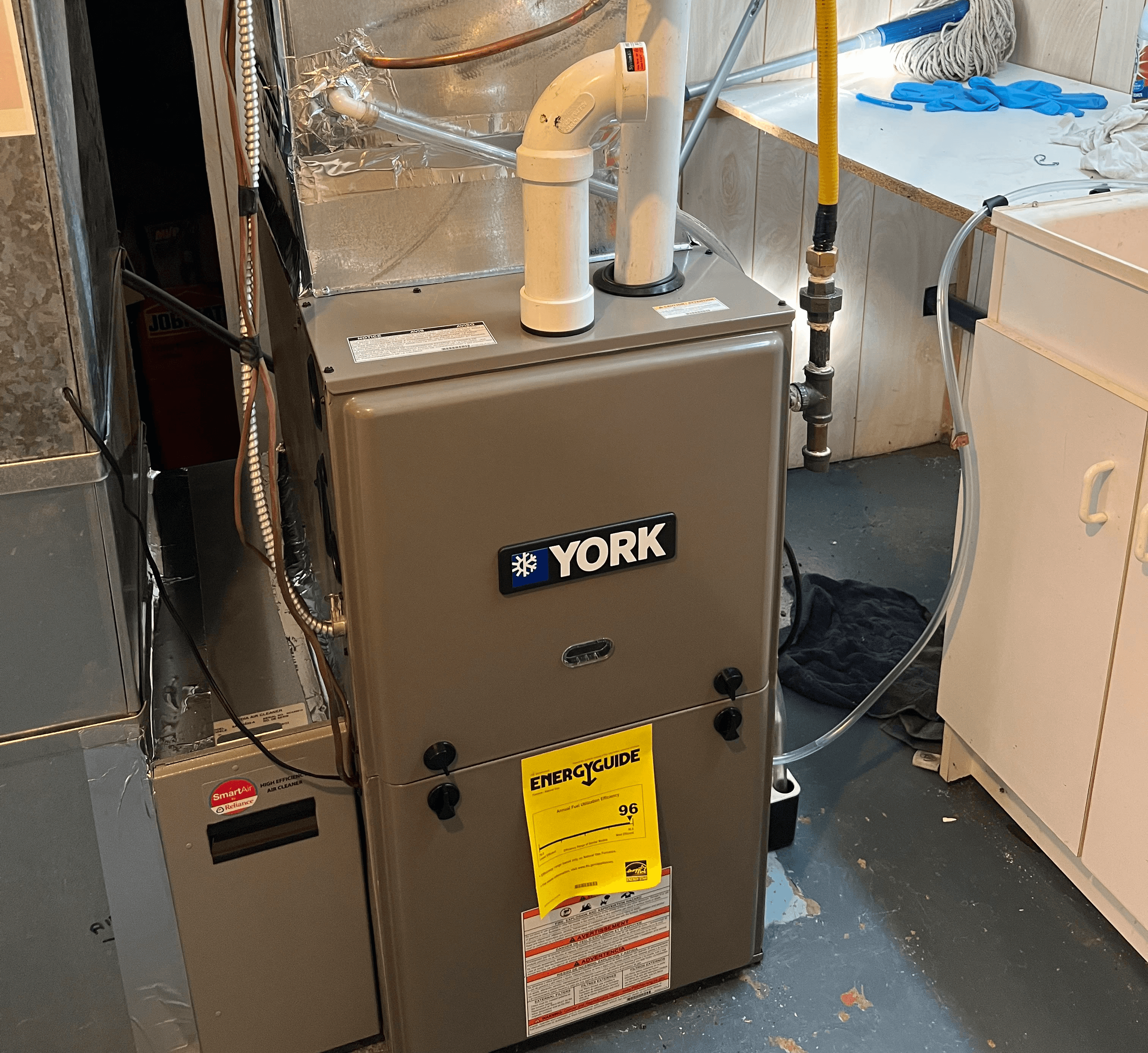 Furnace repair work being performed on a residential heating system in Mississauga