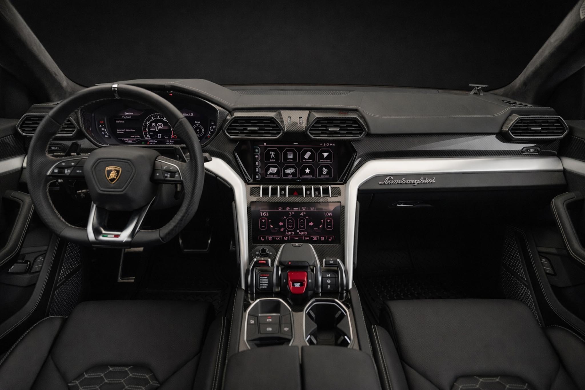 Lamborghini Urus black interior luxury SUV cockpit Dubai rental