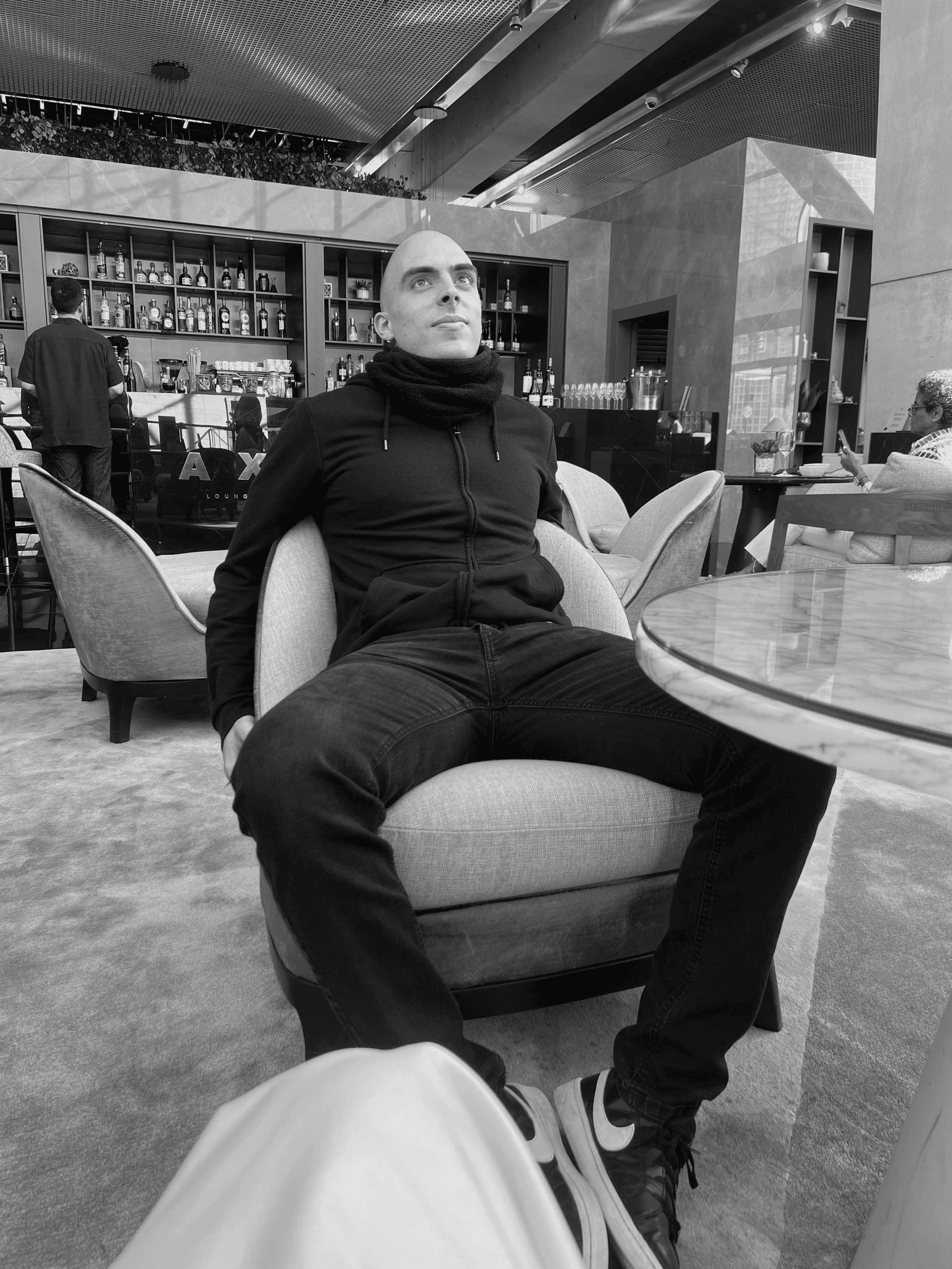 3D-rendered futuristic flower-like object with textured dark petals and a soft white core on a white background