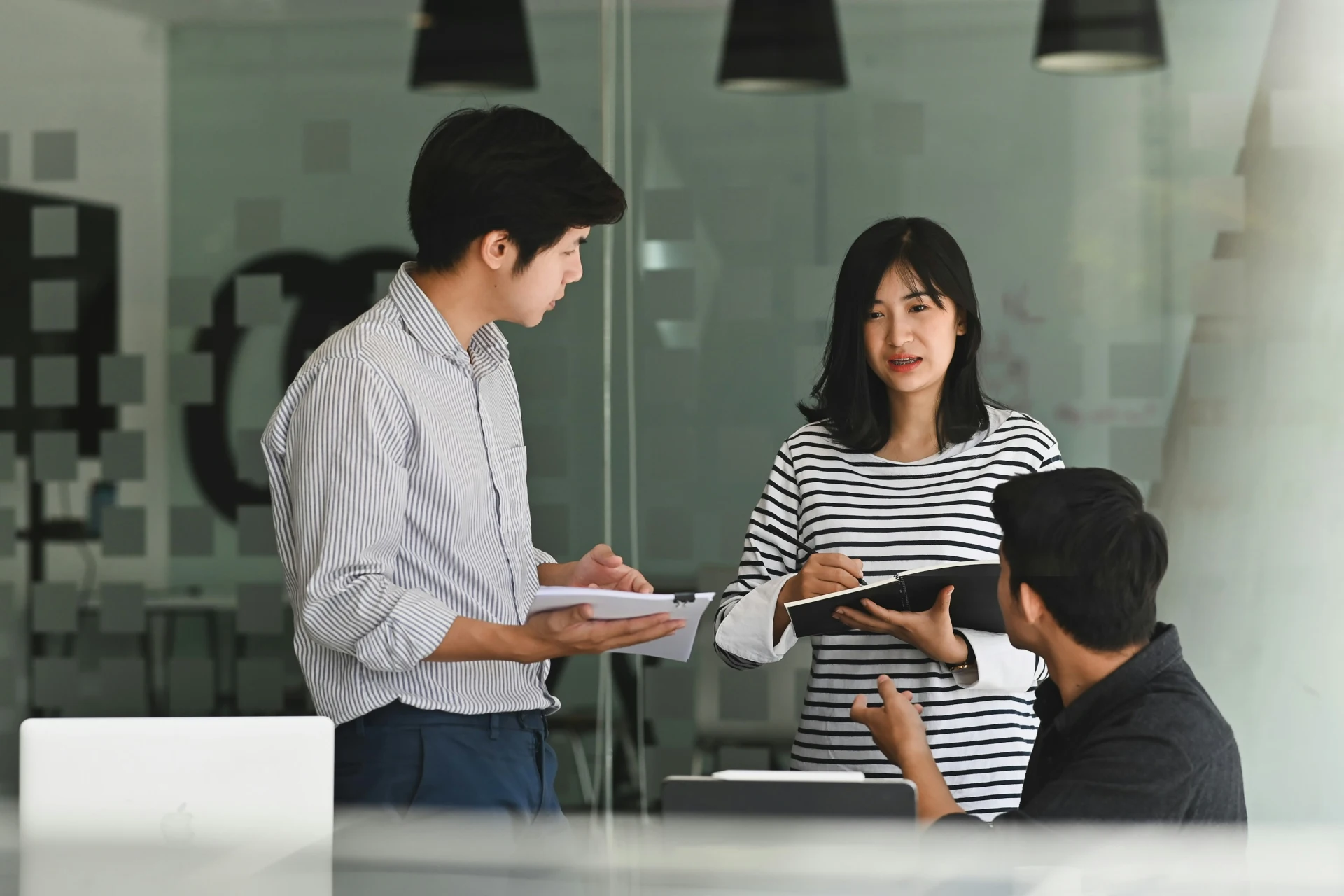 Colleagues talking about staff augmentation in the office