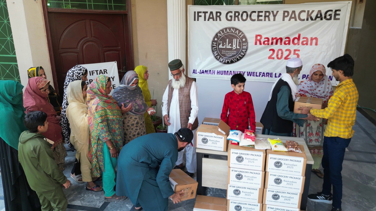 A couple of kids that are sitting in the grass