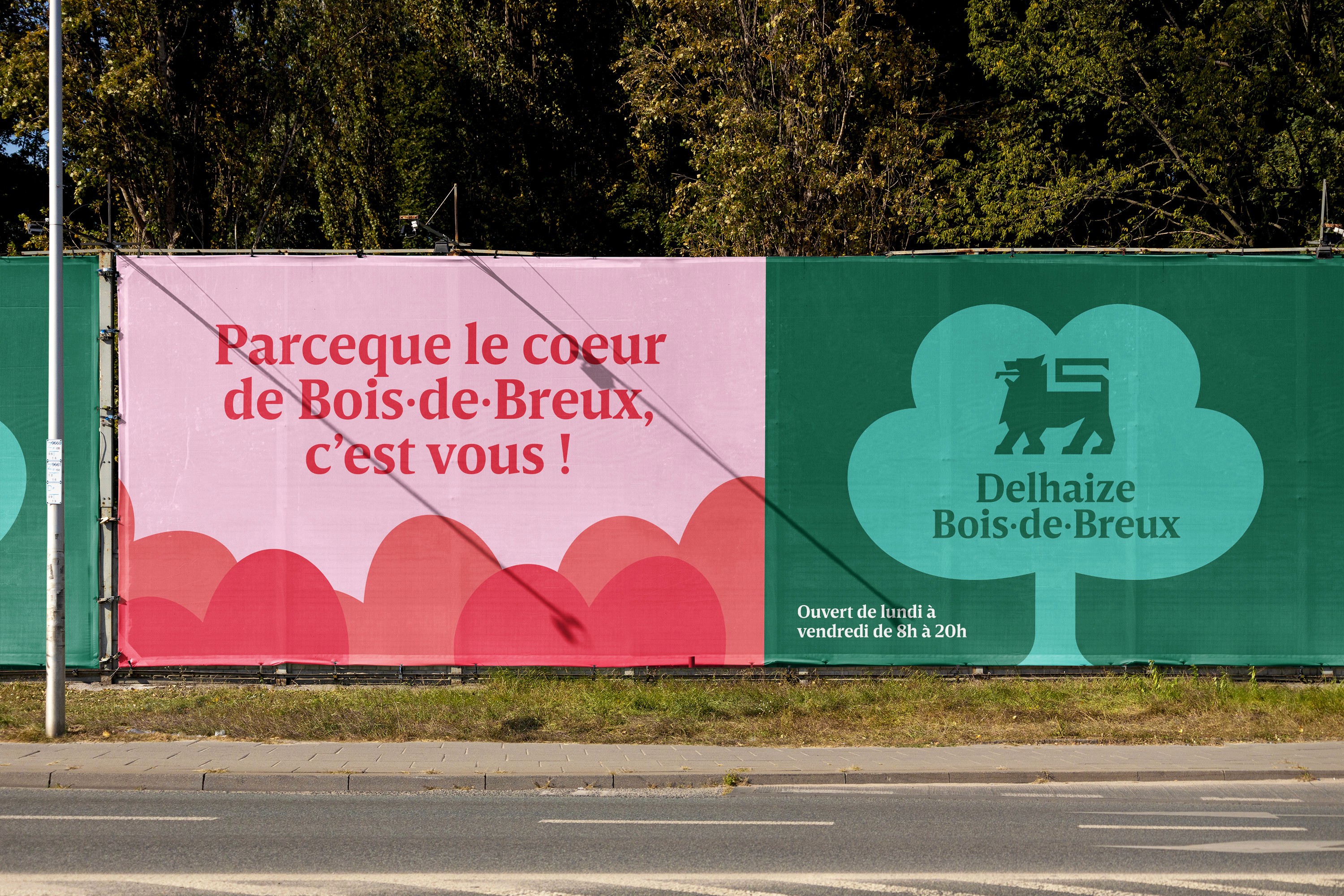 Modern home office setup with a monitor, ergonomic chair, keyboard, and indoor plants near a window with blinds.
