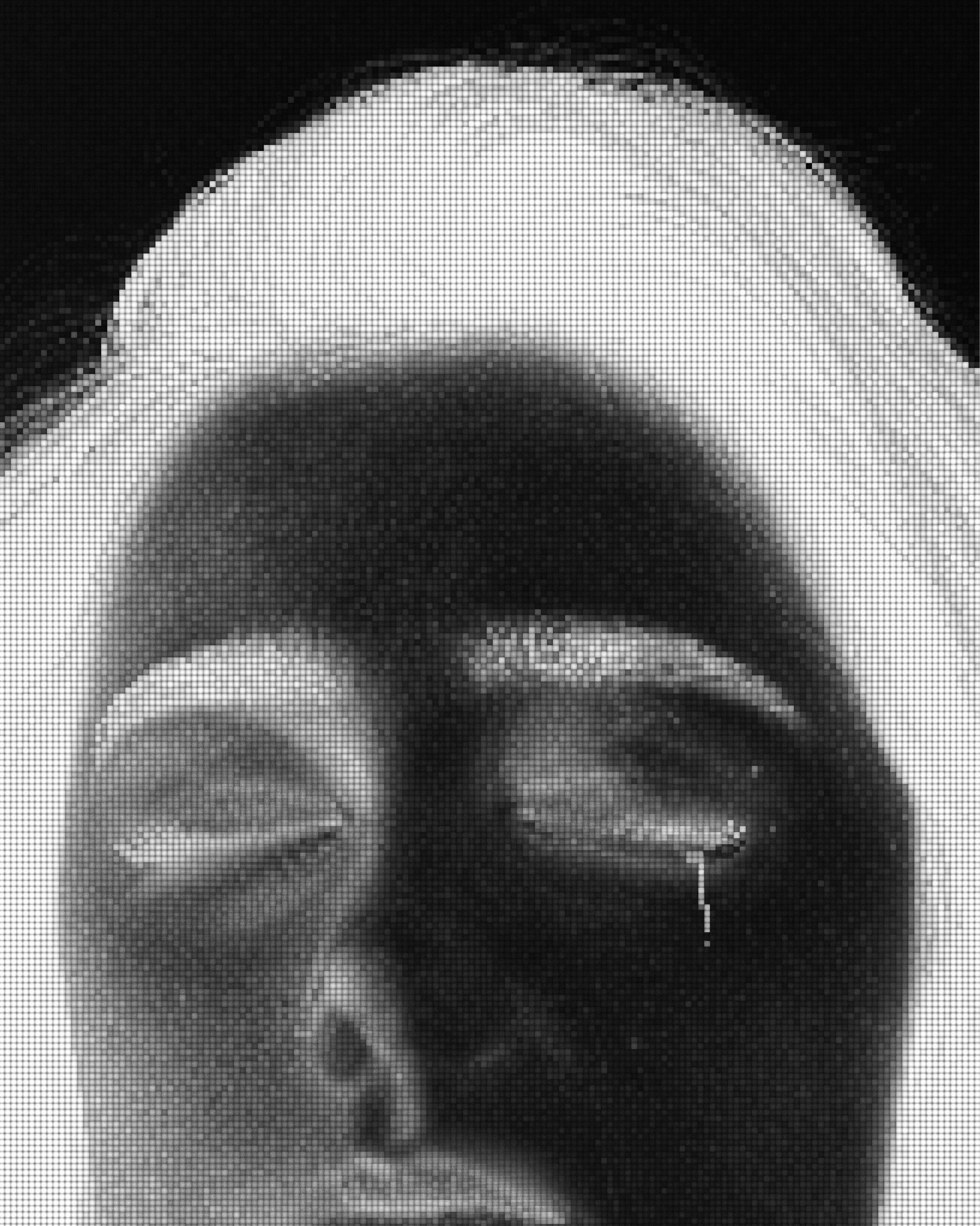 Inverted face with closed eyes and a single tear.
