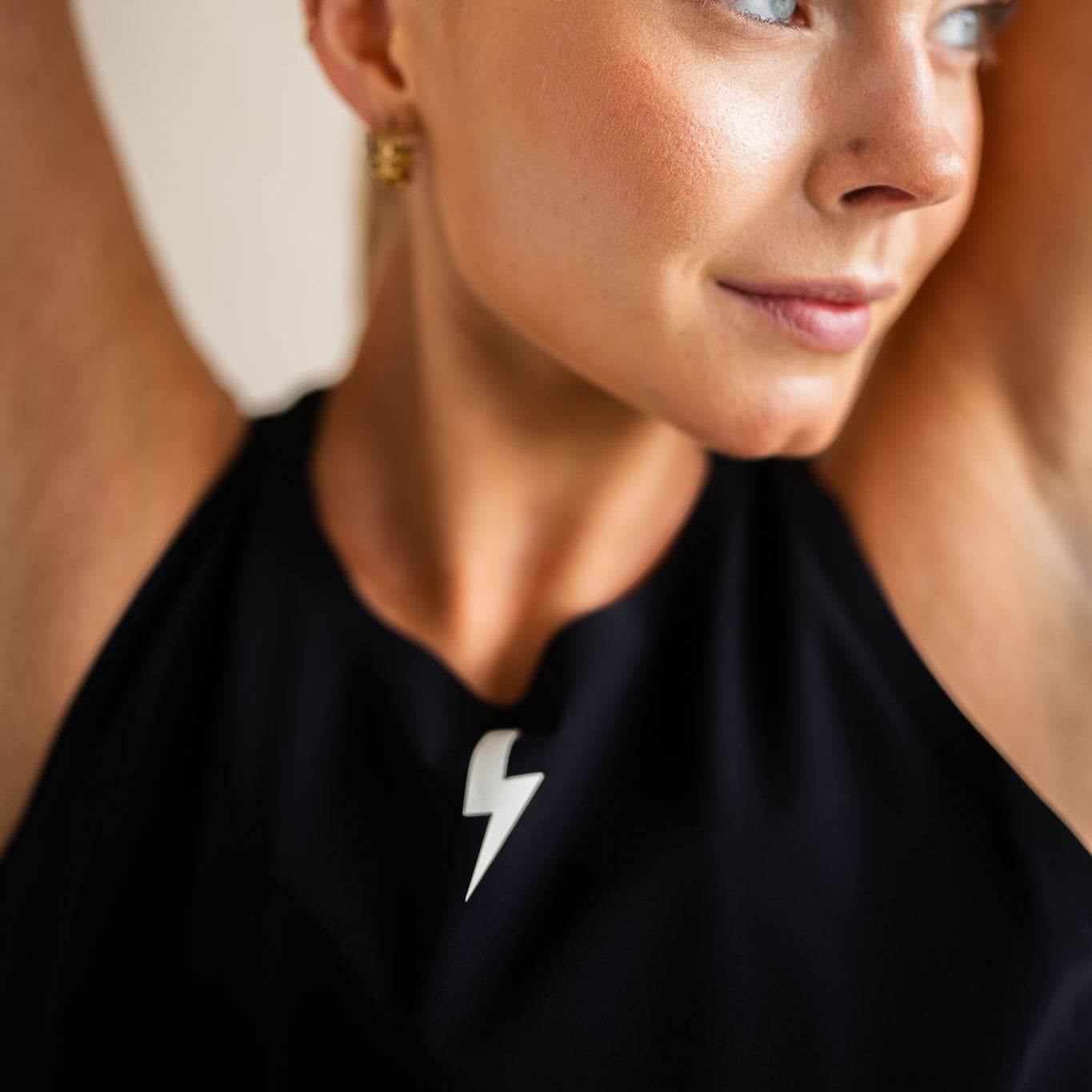 LUCA bolt logo detail on Meander vest in black, neckline close-up