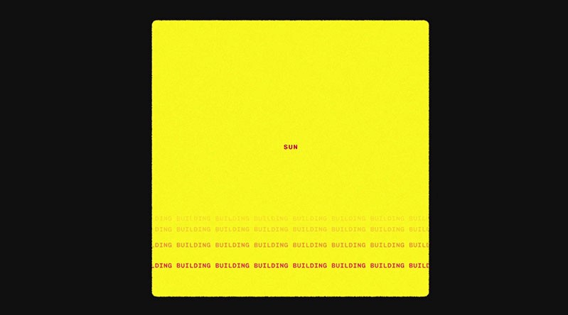 A yellow cube on a black background. The yellow cube has some red text on multiple lines that are fading.