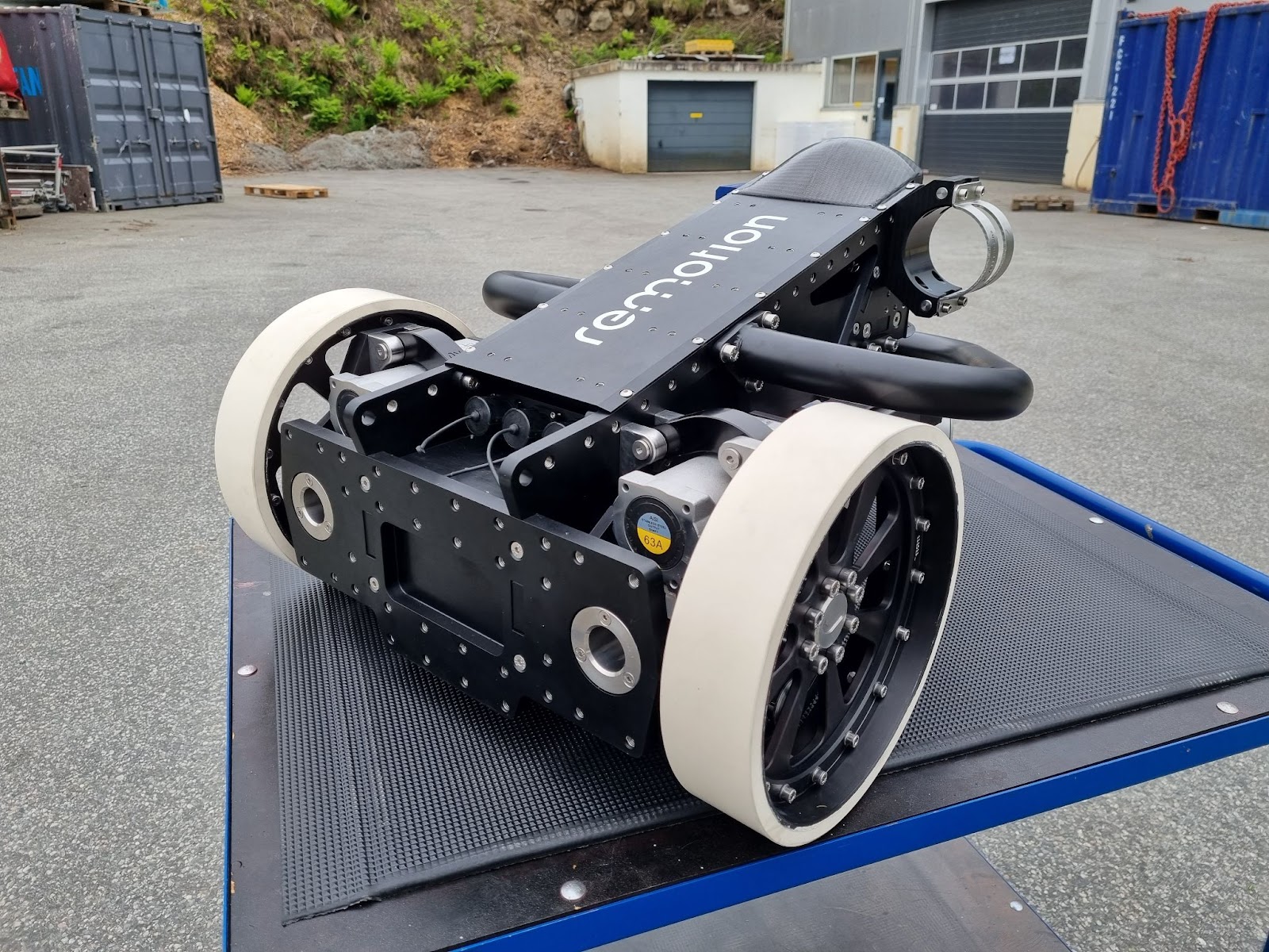 Remotion Proteus robot with magnetic wheels on its transport trailer