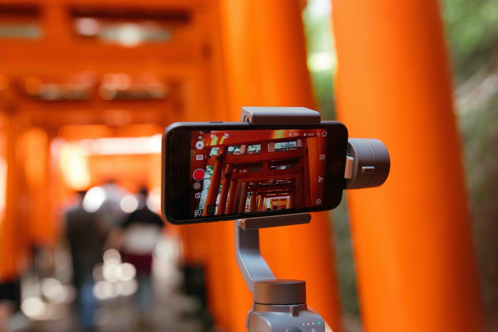 Mobile device attatched to a gimble, livestreaming Inari Shrine with its Journey Japan eSIM connection.