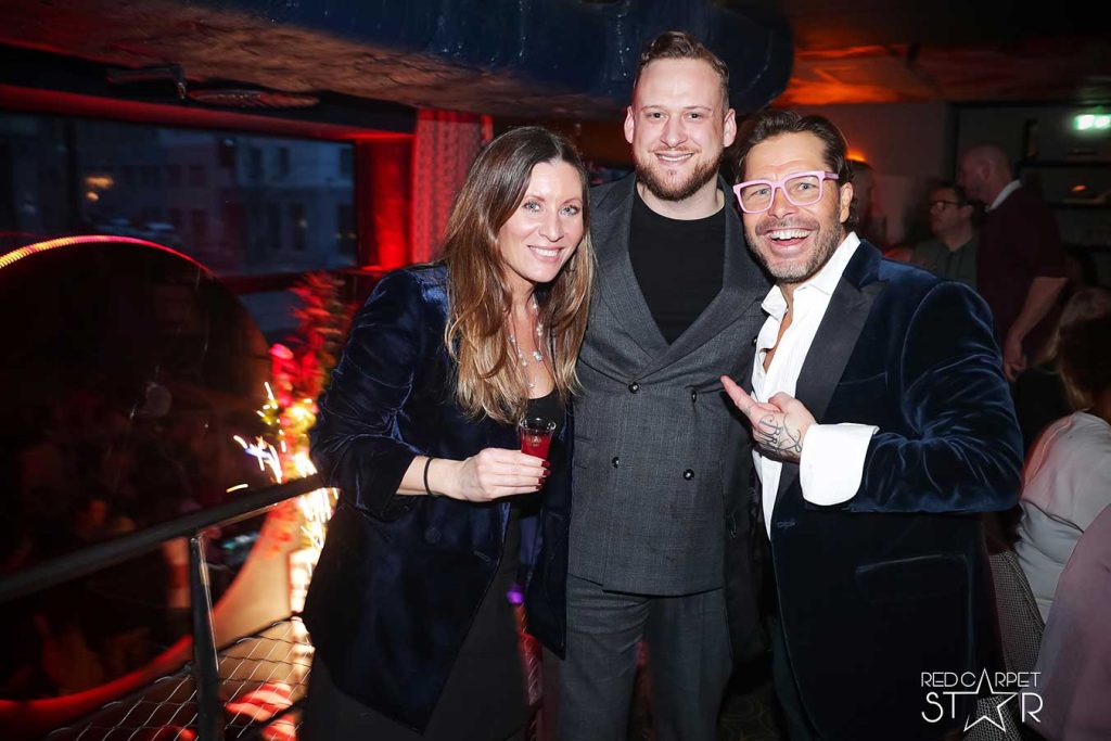 Macro shot of an orange peel being placed on a cocktail