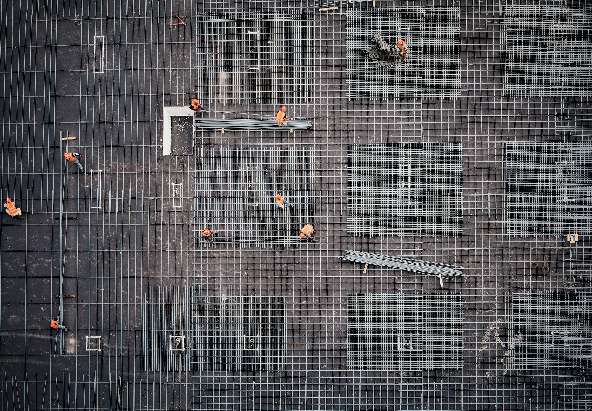 builders laying steel rebar