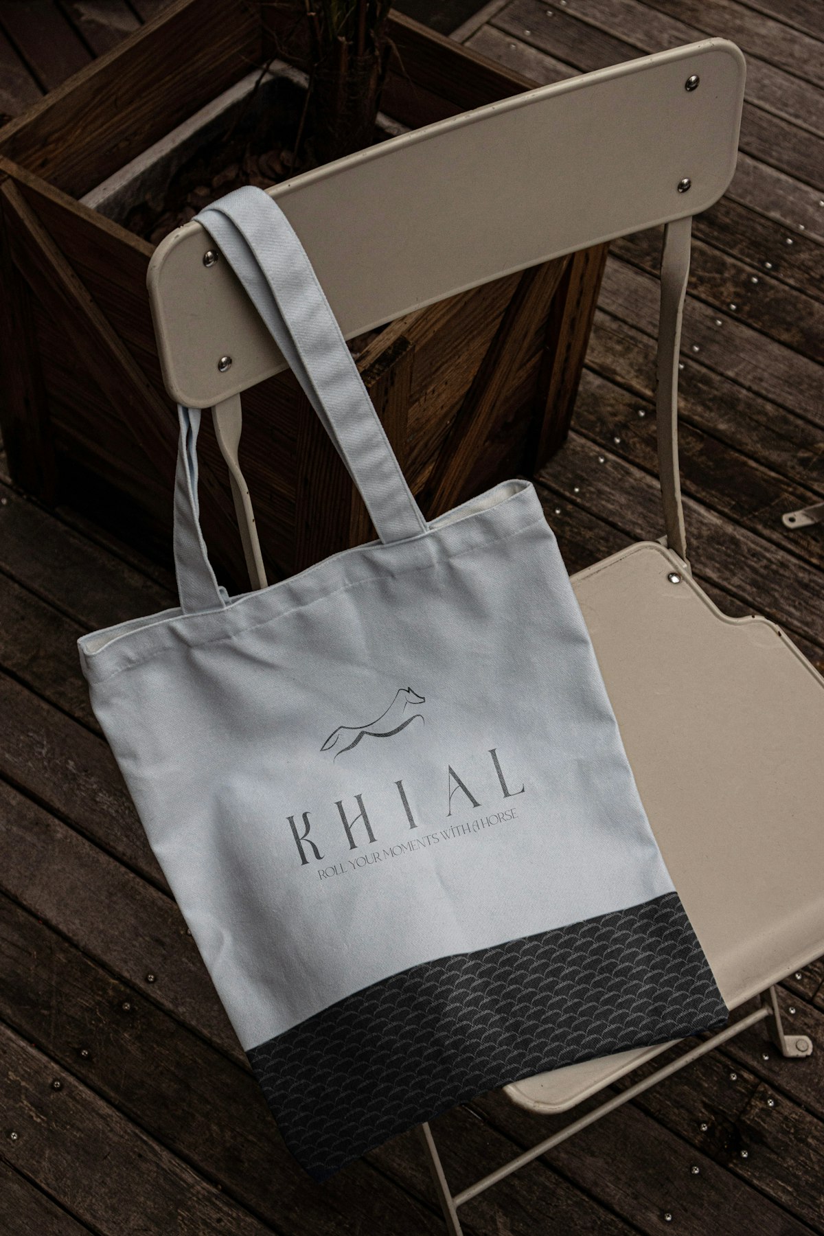 Branded tote bag showing a logo and visual identity