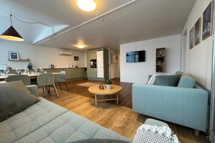 sunloungers fronting buildings near mountain