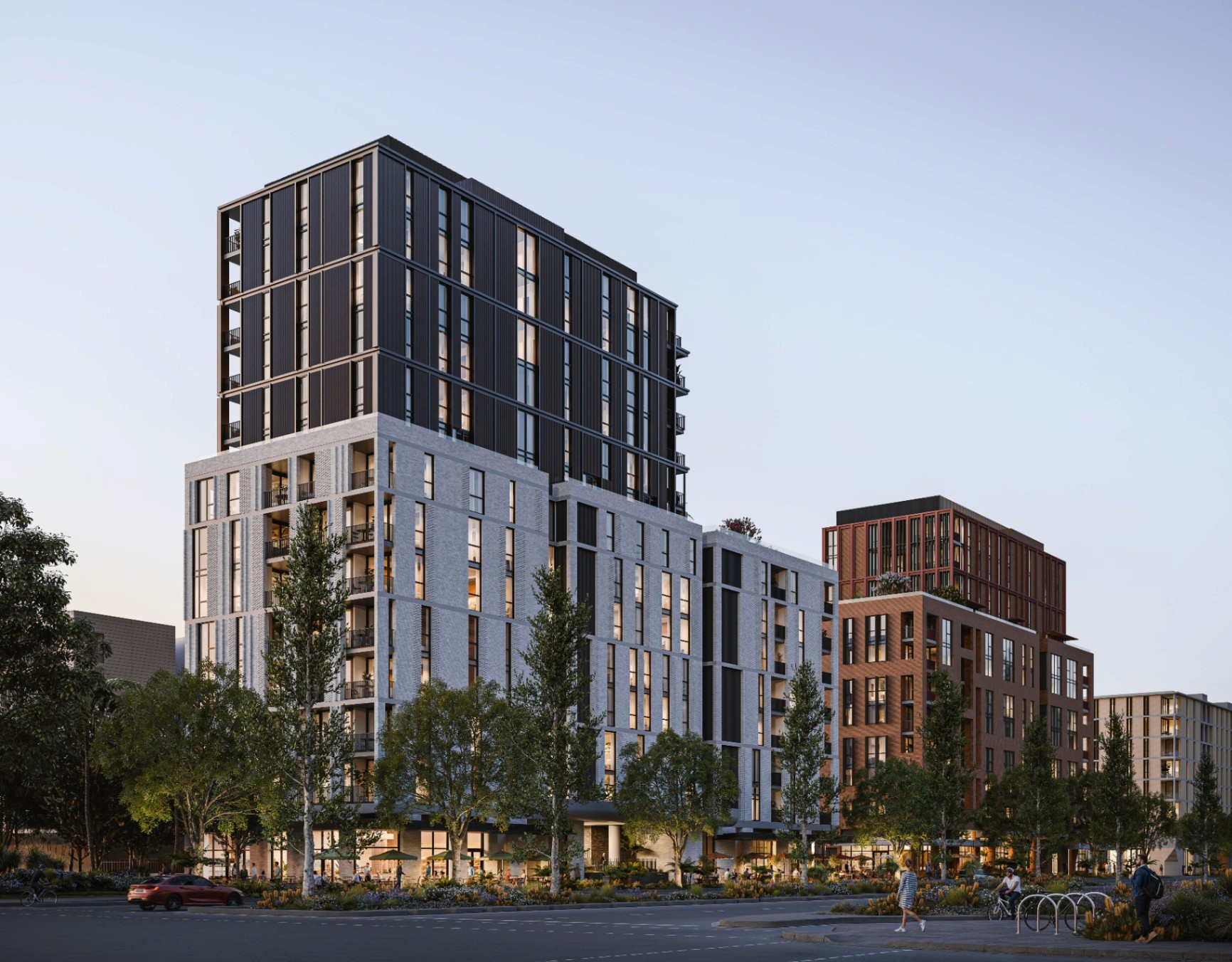Exterior view of The Avenues by Deicorp in Zetland, showing modern apartment buildings surrounded by trees and landscaped streets in inner-city Sydney.