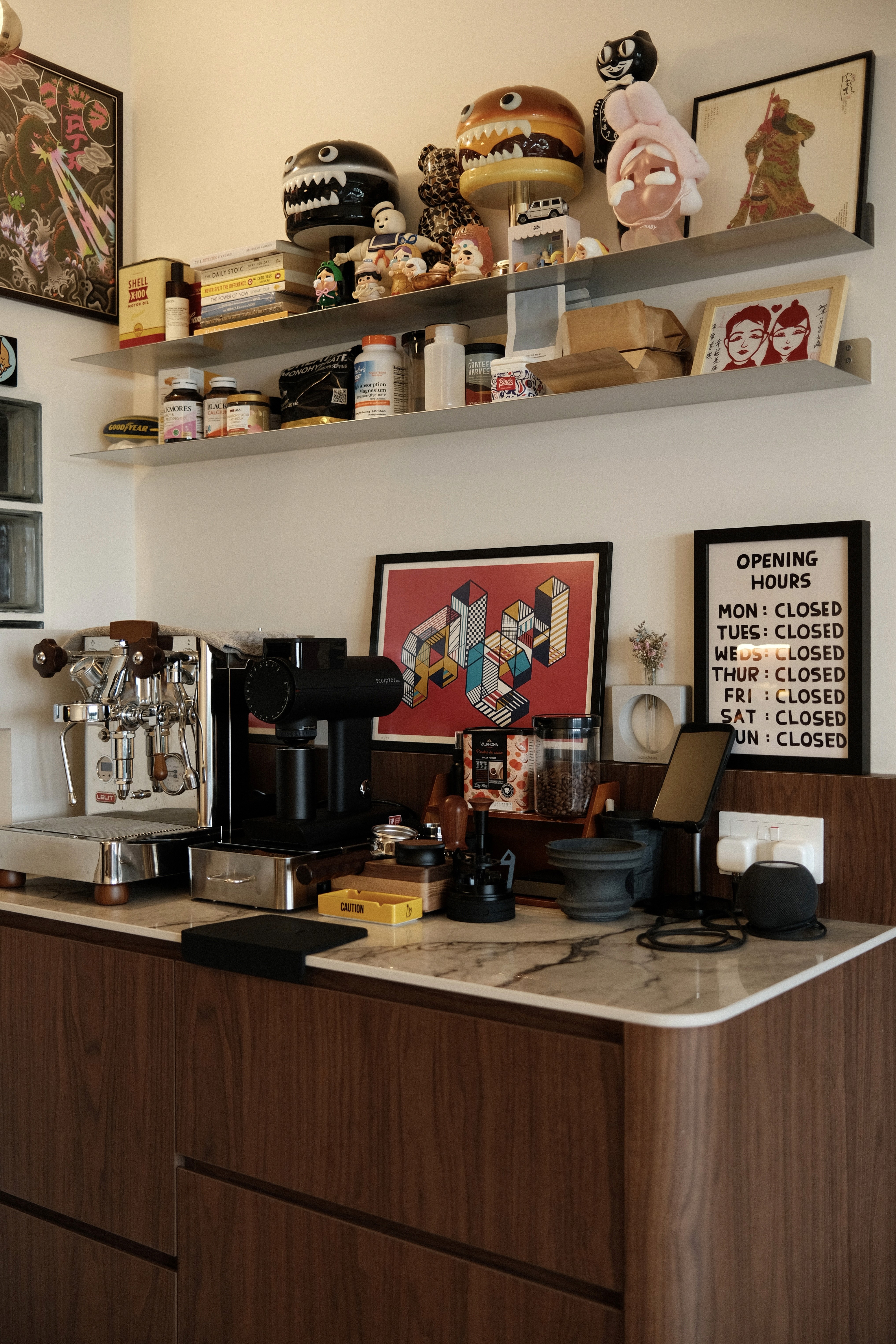 A warm, character-filled coffee corner that blends sleek espresso tools with playful art and curated collectibles.