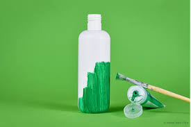 White plastic bottle is coloured with green