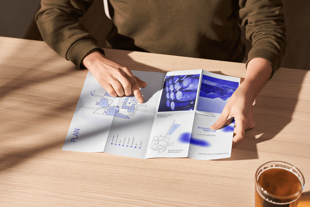 A mockup of a Macbook with the header of the website