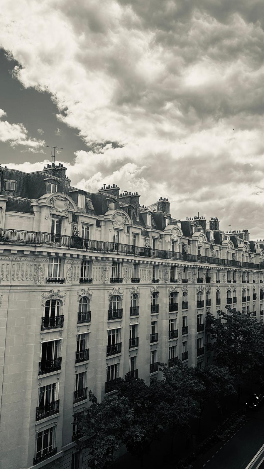 modern sculptural building with curved wooden exterior