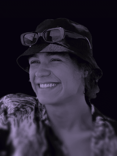 Professional portrait of person on a modern purple gradient background, business headshot for digital branding and team profile.